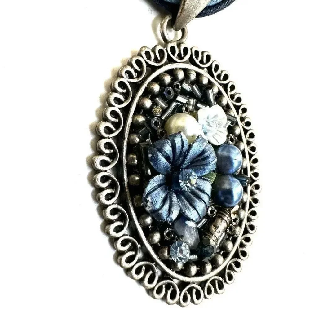 Blue floral beaded pendant necklace on multi cord